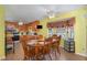 Inviting dining area with a ceiling fan and large wooden table for Gathering meals at 6408 Glen Brack Ct, Raleigh, NC 27603