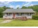 Charming single-story home with a welcoming front porch and accessible ramp at 6408 Glen Brack Ct, Raleigh, NC 27603