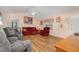 Bright living room with a ceiling fan, artwork, and ample natural light at 6408 Glen Brack Ct, Raleigh, NC 27603