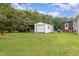Detached shed located in the backyard with trees in the background at 6408 Glen Brack Ct, Raleigh, NC 27603