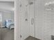 Bright bathroom boasts a glass enclosed shower and white subway tile at 6900 Staghorn Ln, Raleigh, NC 27615