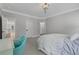 Bedroom with neutral color palette, carpet, large bed and a desk at 6900 Staghorn Ln, Raleigh, NC 27615