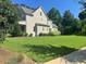 Charming traditional-style home with a beautifully manicured lawn and mature landscaping at 6900 Staghorn Ln, Raleigh, NC 27615