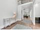 Bright foyer with wood floors, console table, and an open view into the living spaces at 6900 Staghorn Ln, Raleigh, NC 27615