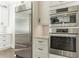 This kitchen features stainless steel appliances, custom cabinets, and stone countertops at 6900 Staghorn Ln, Raleigh, NC 27615