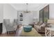 Comfortable living room with elegant furniture, large windows, and stylish decor at 6900 Staghorn Ln, Raleigh, NC 27615