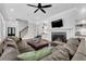 Bright living room with fireplace, built-in shelves, recessed lighting, and comfortable seating at 6900 Staghorn Ln, Raleigh, NC 27615