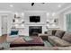 Bright living room with fireplace, built-in shelves, recessed lighting, and comfortable seating at 6900 Staghorn Ln, Raleigh, NC 27615
