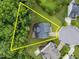 Aerial view of the property showcasing lot lines and the surrounding neighborhood layout at 7502 Latteri Ct, Raleigh, NC 27613