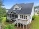 Inviting backyard featuring a screened porch and a deck perfect for outdoor relaxation and entertaining at 7502 Latteri Ct, Raleigh, NC 27613