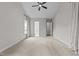 Spacious bedroom featuring neutral carpet and large windows at 7502 Latteri Ct, Raleigh, NC 27613