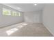Spacious bedroom featuring neutral walls, plush carpeting, double door closet and bright natural light at 7502 Latteri Ct, Raleigh, NC 27613