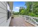 Large wooden deck with white railings, perfect for outdoor entertaining at 7502 Latteri Ct, Raleigh, NC 27613