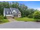 Beautiful two-story home with a well-manicured lawn and tree-lined surroundings at 7502 Latteri Ct, Raleigh, NC 27613
