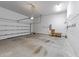 Spacious garage with ample storage space, automatic door, and concrete flooring at 7502 Latteri Ct, Raleigh, NC 27613