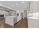 Well-equipped kitchen with stainless appliances, white cabinetry, and a large island for casual dining at 7502 Latteri Ct, Raleigh, NC 27613