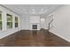 Spacious living room featuring coffered ceiling, fireplace with built-ins and lots of natural light at 7502 Latteri Ct, Raleigh, NC 27613