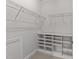 Spacious walk-in closet features built-in shelving to easily organize all of your items at 7502 Latteri Ct, Raleigh, NC 27613