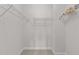 Bright walk-in closet offers ample storage with wire shelving ready to organize your wardrobe at 7502 Latteri Ct, Raleigh, NC 27613
