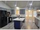 An open-concept kitchen with an island and modern appliances at 78 Phil Johnson Rd, Sanford, NC 27330