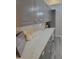 Updated kitchen with light grey cabinetry, marble countertop, and a white subway tile backsplash at 78 Phil Johnson Rd, Sanford, NC 27330