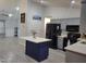Bright kitchen featuring a center island, modern appliances, and an open design into another living area at 78 Phil Johnson Rd, Sanford, NC 27330