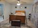 Comfortable primary bedroom with wood floors, overhead fan, and modern decor at 78 Phil Johnson Rd, Sanford, NC 27330