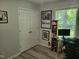 Home office features a desk, wood-look floors, and natural light from the window at 78 Phil Johnson Rd, Sanford, NC 27330