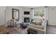 Inviting living room with a fireplace, large window, comfortable seating, and stylish decor at 83 Lone Star Dr, Lillington, NC 27546