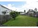 Large backyard featuring a fenced in yard with an ample green lawn at 83 Mariners Point Way, Garner, NC 27529