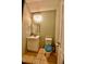 Small bathroom features a vanity with storage, a toilet, and a tiled floor at 83 Mariners Point Way, Garner, NC 27529