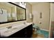 Bathroom featuring a double sink vanity, a large mirror, and a separate shower for convenience at 83 Mariners Point Way, Garner, NC 27529