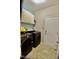 A well-lit laundry room featuring a modern washer and dryer set and ample storage cabinets at 83 Mariners Point Way, Garner, NC 27529
