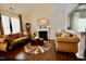 Cozy living room with high ceilings, a fireplace and hardwood flooring at 83 Mariners Point Way, Garner, NC 27529