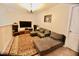 Cozy living room with comfortable seating, a chandelier, and a large screen TV for entertainment at 83 Mariners Point Way, Garner, NC 27529