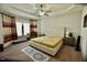 Main bedroom showcases a tray ceiling, plush carpet, and stylish furnishings at 83 Mariners Point Way, Garner, NC 27529
