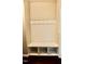 Functional mud room with a built-in bench, coat hooks, and storage cubbies at 83 Mariners Point Way, Garner, NC 27529