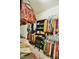 Walk-in closet features ample hanging space for clothing and shelving for accessories at 83 Mariners Point Way, Garner, NC 27529
