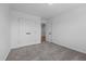 Bedroom features carpeted floors, neutral walls, closet and an open door with hardwood flooring at 834-836 Day Ave, Burlington, NC 27217