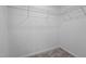 Empty walk-in closet features carpeted floor, white walls, and wire shelving at 834-836 Day Ave, Burlington, NC 27217