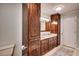 Primary bathroom with a granite countertop, wood cabinets, and stylish accents at 835 Pearleman Teague Rd, Siler City, NC 27344