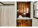 Bathroom shower and cabinets with granite countertop at 835 Pearleman Teague Rd, Siler City, NC 27344