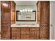 Bathroom vanity with double sinks, granite counters, and custom wood cabinets at 835 Pearleman Teague Rd, Siler City, NC 27344