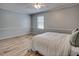 Relaxing bedroom featuring a queen size bed, chair railing, and a ceiling fan at 835 Pearleman Teague Rd, Siler City, NC 27344