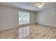 Bright bedroom with hardwood floors, a ceiling fan, and a large window at 835 Pearleman Teague Rd, Siler City, NC 27344