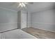 Bedroom features a ceiling fan, baseboard trim, and an interior door at 835 Pearleman Teague Rd, Siler City, NC 27344