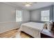 Bedroom featuring a ceiling fan and two windows, creating a bright and airy space at 835 Pearleman Teague Rd, Siler City, NC 27344