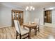 Traditional dining room with hardwood floors, complemented by classic furniture and a hutch at 835 Pearleman Teague Rd, Siler City, NC 27344