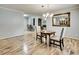 Dining room showcases wood floors and open layout to the living room with fireplace at 835 Pearleman Teague Rd, Siler City, NC 27344