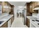 Traditional kitchen featuring wood cabinetry, stainless steel appliances, and stone countertops at 835 Pearleman Teague Rd, Siler City, NC 27344
